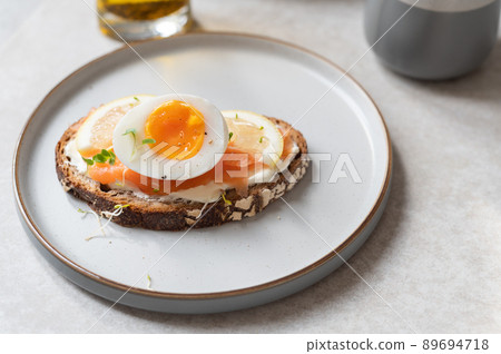 Toast with salmon and medium boiled eggs Toast with salmon and medium boiled eggs 89694718