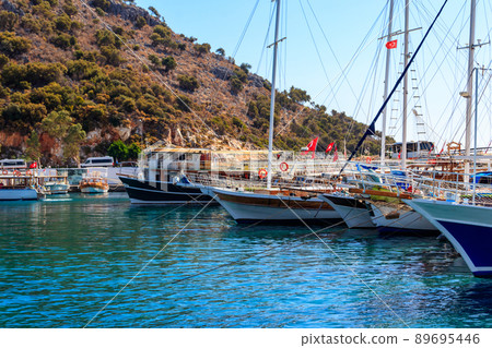 Port with tourist boats on the Mediterranean sea coast in Turkey 89695446