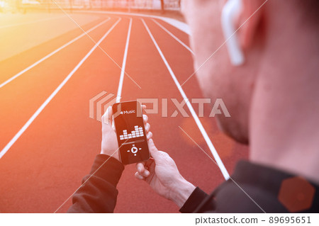 Sport music. Lifestyle workout exercise man training. Male with headphones. Sport music and healthy lifestyle. Sport music. Lifestyle workout exercise man training. Male with headphones. Sport music and healthy lifestyle. 89695651