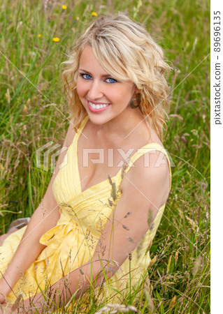 Smiling Female Girl or Young Woman Outside in Sunshine 89696135