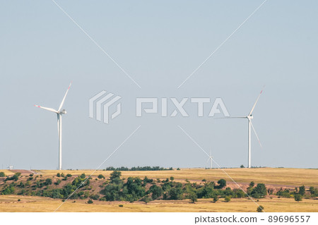Wind turbines in an arid landscape. An alternative way of generating electricity 89696557