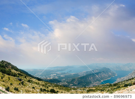 Beautiful nature mountains landscape. Kotor bay, Montenegro. Views of the Boka Bay, with the cities of Kotor and Tivat with the top of the mountain, Montenegro Beautiful nature mountains landscape. Kotor bay, Montenegro. Views of the Boka Bay, with the cities of Kotor and Tivat with the top of the mountain, Montenegro 89696973