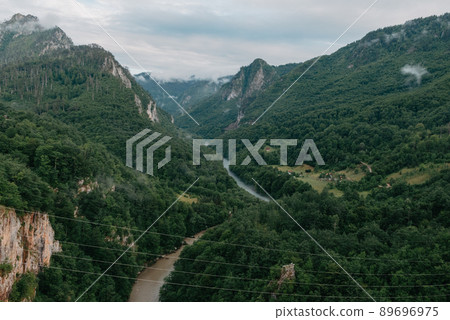 Tara River, view from the bridge, north Montenegro. Canyon of river Tara, deepest canyon in the Europe, second in the world. State of Montenegro Tara River, view from the bridge, north Montenegro. Canyon of river Tara, deepest canyon in the Europe, second in the world. State of Montenegro 89696975