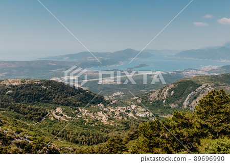 Beautiful nature mountains landscape. Kotor bay, Montenegro. Views of the Boka Bay, with the cities of Kotor and Tivat with the top of the mountain, Montenegro Beautiful nature mountains landscape. Kotor bay, Montenegro. Views of the Boka Bay, with the cities of Kotor and Tivat with the top of the mountain, Montenegro 89696990