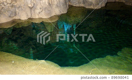 A blue underground lake in a natural limestone cave that is not a facility on the main island of Okinawa 89698041