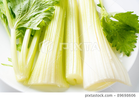Cut celery. Cut celery. 89698606