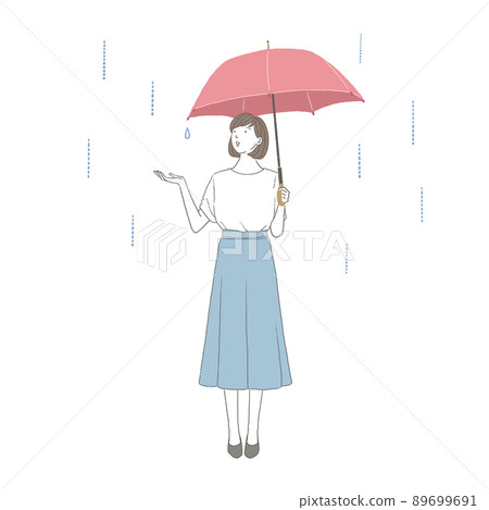 A woman holding an umbrella when going out on a rainy day 89699691