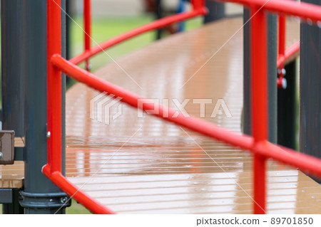 Outdoor playsets and benches wet in the rain Outdoor playsets and benches wet in the rain 89701850