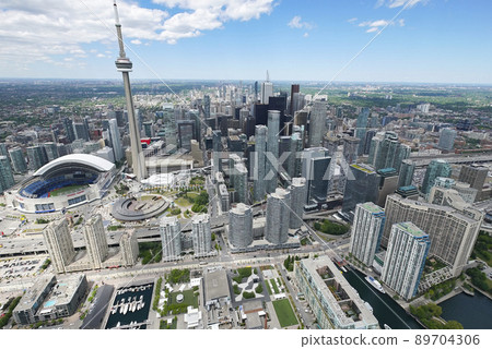 The CN Tower and the Roger centre during the day The CN Tower and the Roger centre during the day 89704306