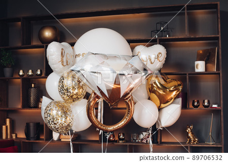 Bridal air balloons against book shelves. 89706532