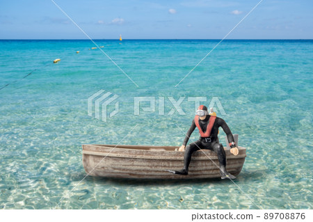 Miniature people Scuba Diver standing on The boat 89708876