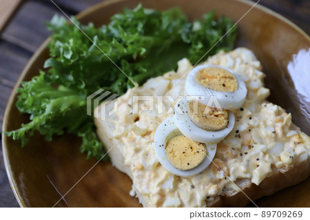 Open sandwich with lots of egg on top Open sandwich with lots of egg on top 89709269