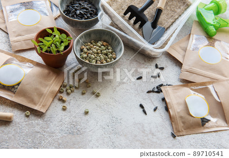 Microgreen seeds in paper bags and equipment for sowing microgreens. 89710541