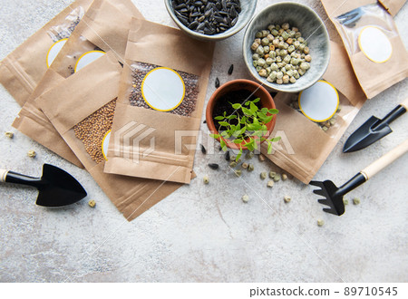 Microgreen seeds in paper bags and equipment for sowing microgreens. 89710545