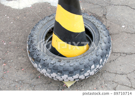 Color cones, triangular cones, rubber cones, tires, road cones, pylon, cones, attention, outdoors Color cones, triangular cones, rubber cones, tires, road cones, pylon, cones, attention, outdoors 89710714