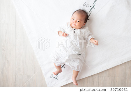 1 month old baby, infant height measurement, height meter, growth copy space 89710981