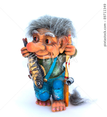 Fisher troll with fishing rod and fish figurine on white background 89711349