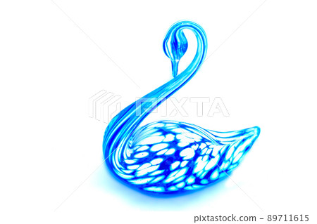 Glass swan figurine on white background Glass swan figurine on white background 89711615