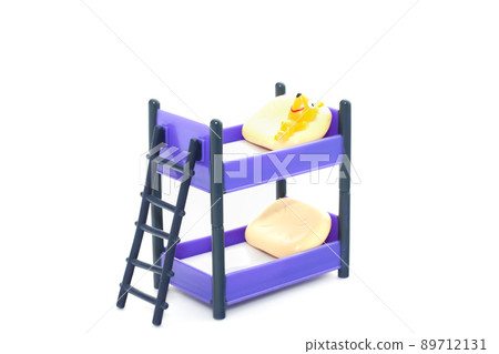 Doll bunk bed with stairs and pillows on white background 89712131