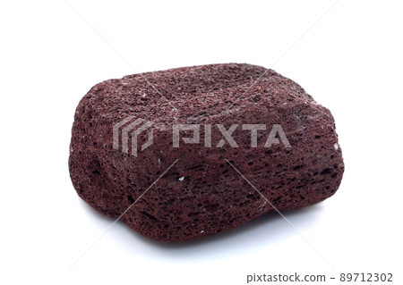 Brown pumice on a white background Brown pumice on a white background 89712302