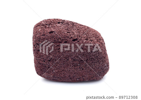 Brown pumice on a white background Brown pumice on a white background 89712308