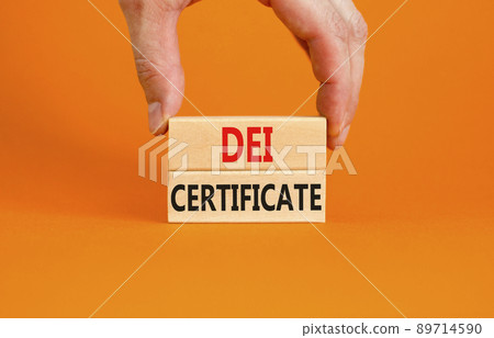 DEI diversity equity inclusion certificate symbol. Blocks with words DEI certificate on beautiful orange background. Business DEI diversity equity inclusion certificate concept. Copy space. 89714590
