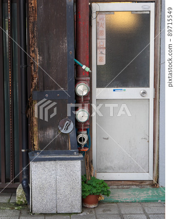 Old fire hydrants and doors in an old town Old fire hydrants and doors in an old town 89715549