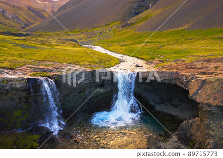 Skutafoss waterfalls near Hofn in Iceland photographed at sunset Skutafoss waterfalls near Hofn in Iceland photographed at sunset 89715773
