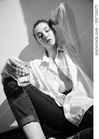 young woman with alcohol 89716075