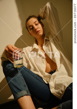 young woman with alcohol 89716077