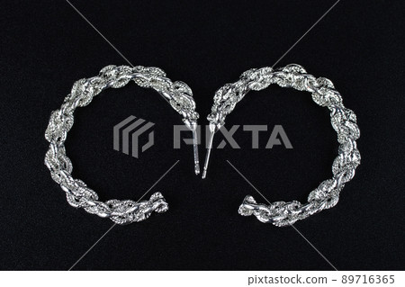 Jewelry earrings and costume jewelry on a black background 89716365