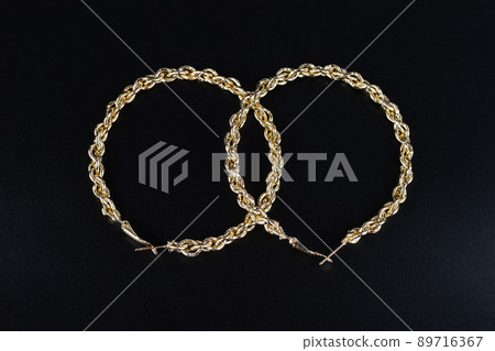 Jewelry earrings and costume jewelry on a black background Jewelry earrings and costume jewelry on a black background 89716367