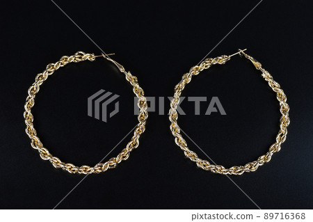 Jewelry earrings and costume jewelry on a black background Jewelry earrings and costume jewelry on a black background 89716368