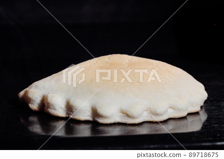 Homemade shortcrust pastry pie baking and rising in electric oven - close up 89718675