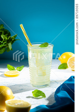 Glass of fresh homemade tasty lemonade with copyspace. Vertical format. 89719303