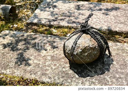A barrier stone in a Japanese garden that indicates no entry 89720834