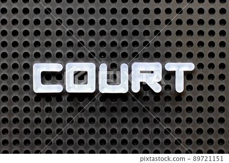 White color alphabet with word court on black pegboard background White color alphabet with word court on black pegboard background 89721151