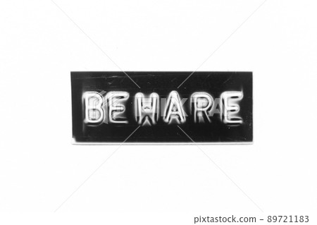 Black color banner that have embossed letter with word beware on white paper background Black color banner that have embossed letter with word beware on white paper background 89721183