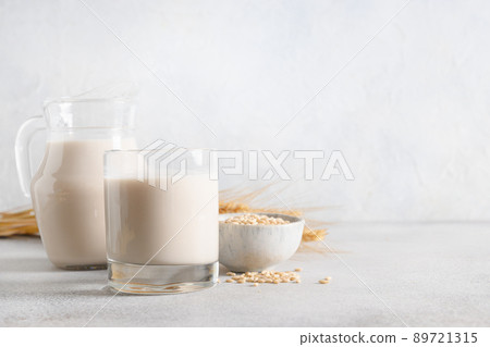 Vegan Barley milk in glass, plant based milk replacer. Vegan Barley milk in glass, plant based milk replacer. 89721315