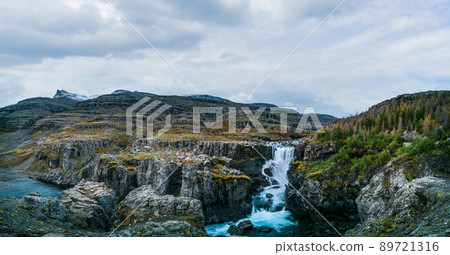Spectacular winter landscape with waterfall and mountain peaks Spectacular winter landscape with waterfall and mountain peaks 89721316
