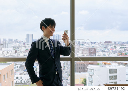 Businessman checking email Businessman checking email 89721492