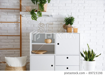 Chest of drawers in stylish room interior Chest of drawers in stylish room interior 89723198