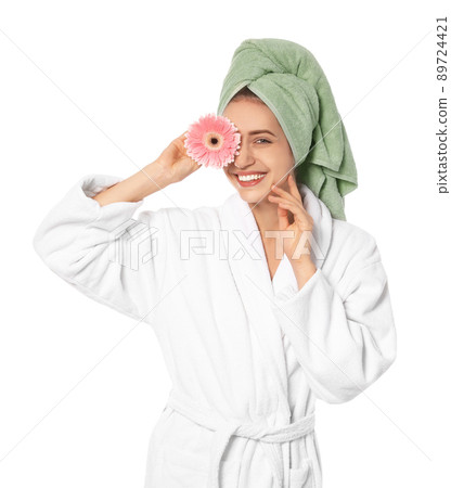 Beautiful young woman with flower wearing bathrobe on white background Beautiful young woman with flower wearing bathrobe on white background 89724421