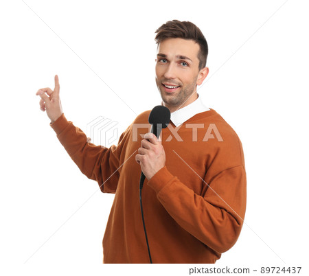 Young male journalist with microphone on white background 89724437