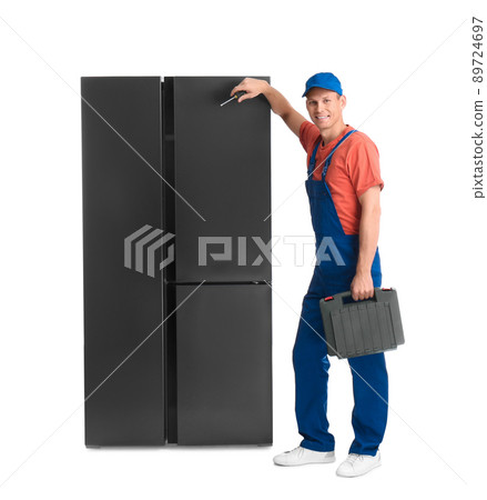 Male technician with tool box near refrigerator on white background 89724697