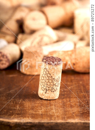 bottle corks on the wooden background. Dated wine bottle corks on the wooden background. Close up 89725272
