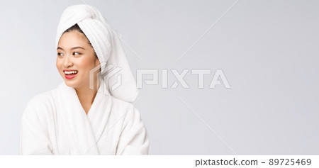 Portrait of a young happy asian lady in bathrobe.Isolated in white background. Portrait of a young happy asian lady in bathrobe.Isolated in white background. 89725469