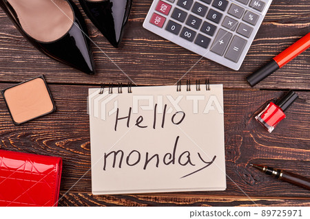 Top view flat lay note with hello monday handwriting. 89725971