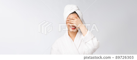 Spa skincare beauty Asian woman drying hair with towel on head after shower treatment. Beautiful multiracial young girl touching soft skin Spa skincare beauty Asian woman drying hair with towel on head after shower treatment. Beautiful multiracial young girl touching soft skin 89726303