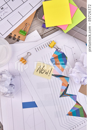 Work papers with charts and binder clips top view. Work papers with charts and binder clips top view. 89726372